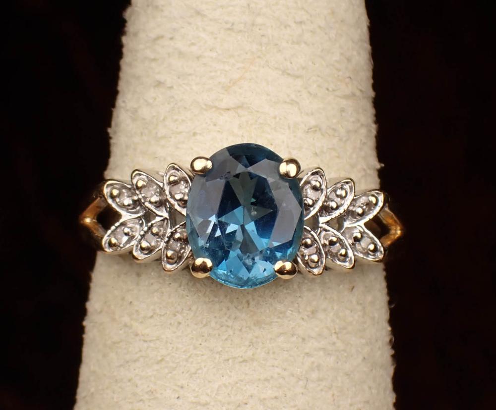 Appraisal: BLUE TOPAZ DIAMOND AND FOURTEEN KARAT GOLD RING The yellow