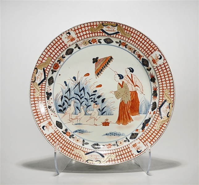 Appraisal: Japanese-style porcelain charger depicting two ladies with an umbrella blue