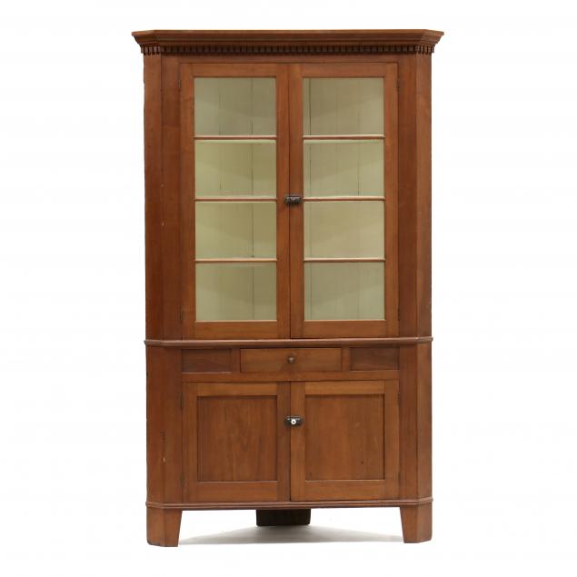 Appraisal: MID-ATLANTIC LATE FEDERAL WALNUT CORNER CUPBOARD Mid th century poplar