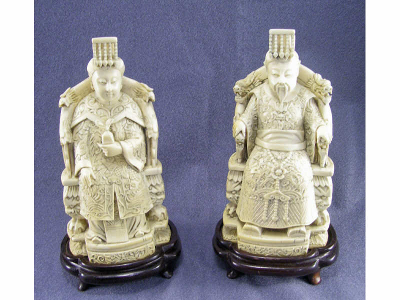 Appraisal: Pair of Ivory Seated Figures Pair of Chinese carved ivory