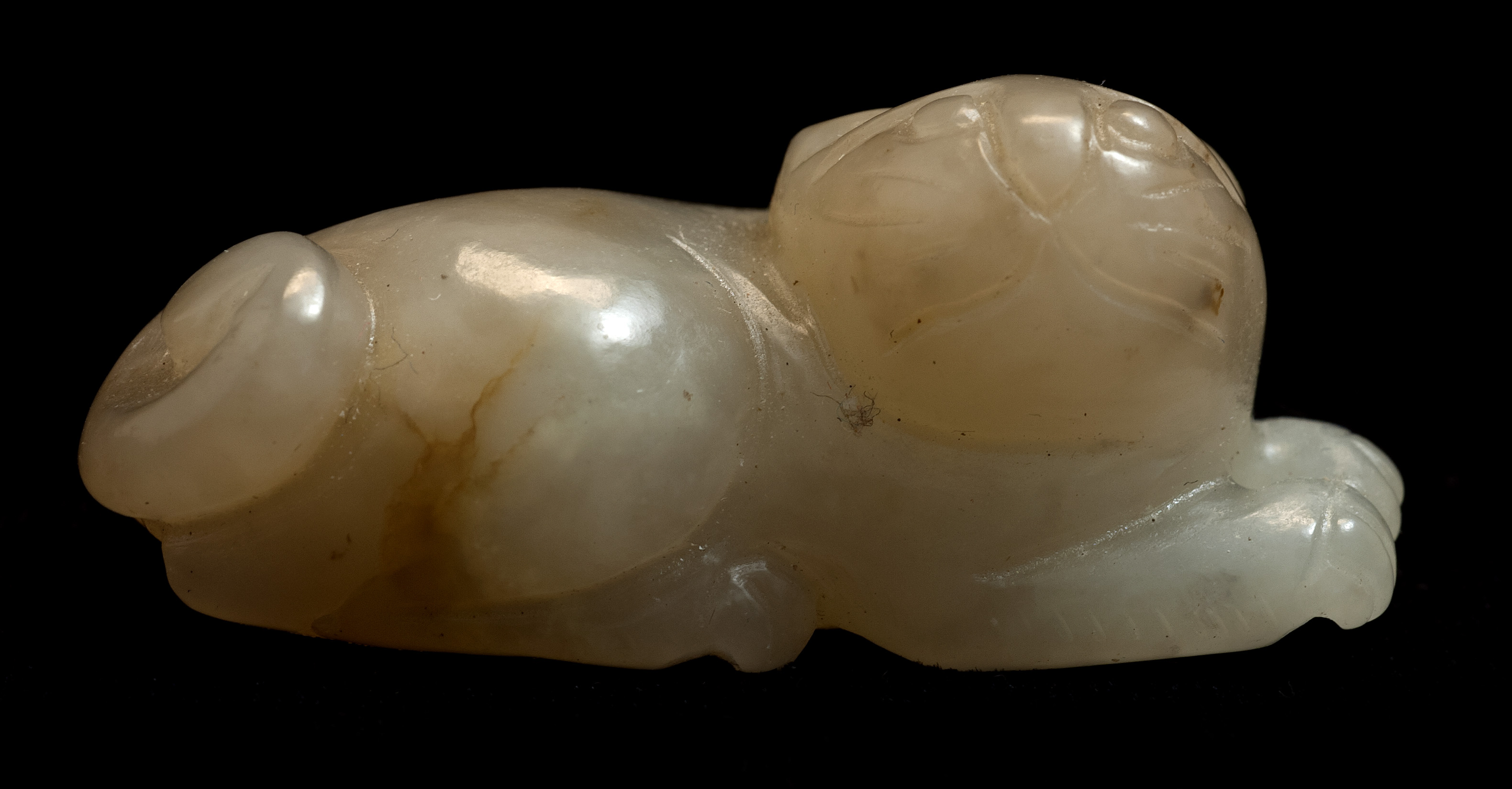 Appraisal: WHITE AND BROWN JADE CARVING Circa In the form of