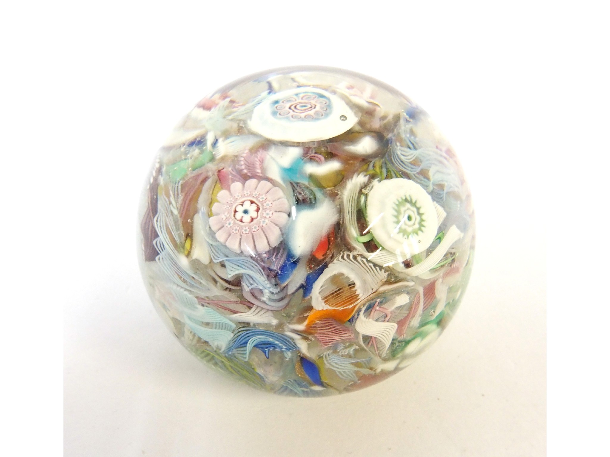 Appraisal: An antique glass paperweight with millefiori and cane twists