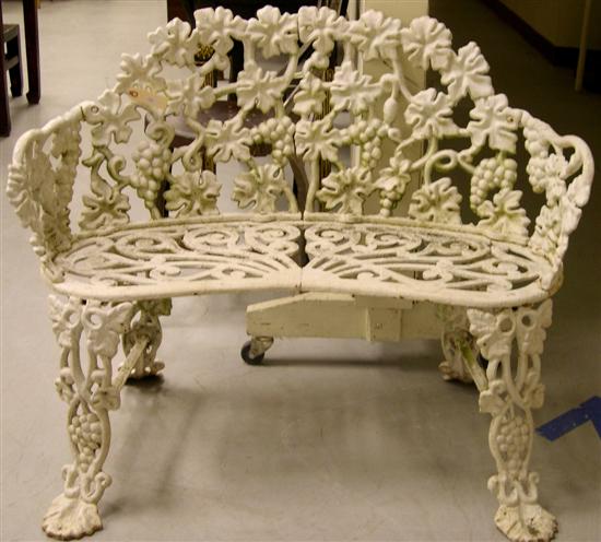 Appraisal: Cast iron garden settee with elaborate pierced grapevine and cluster