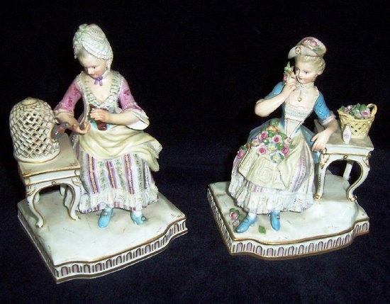 Appraisal: Two Meissen figures of seated ladies one modelled feeding a