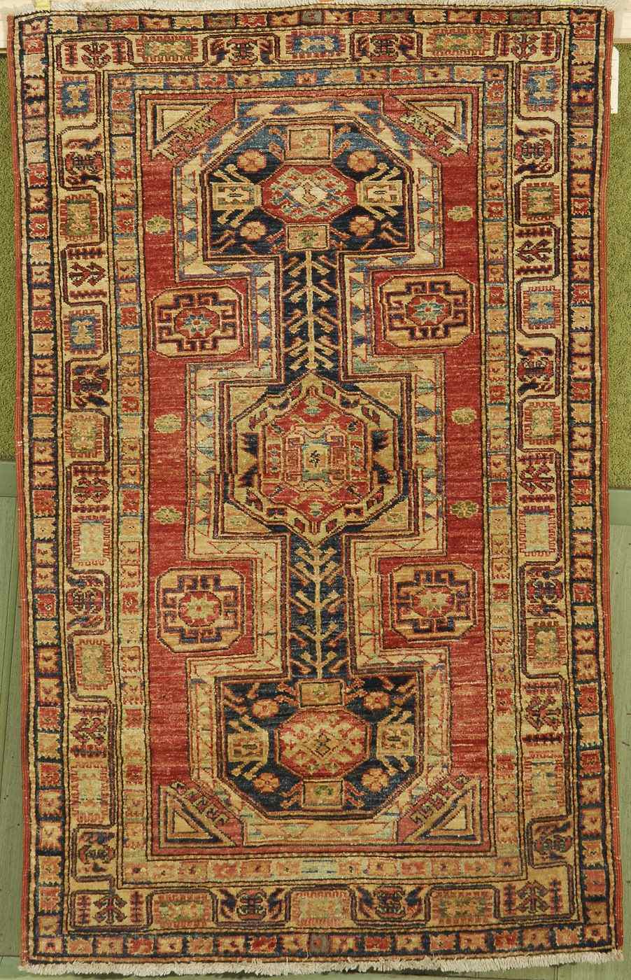 Appraisal: ORIENTAL RUG KAZAK DESIGN ' x ' '' Traditional geometric