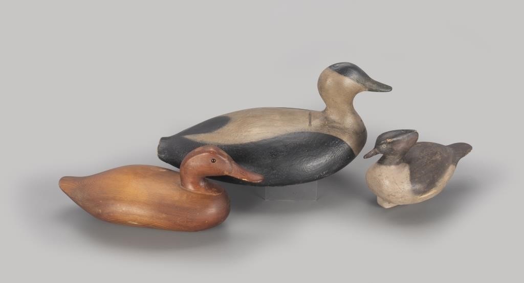 Appraisal: eider is in long A group of three duck decoys