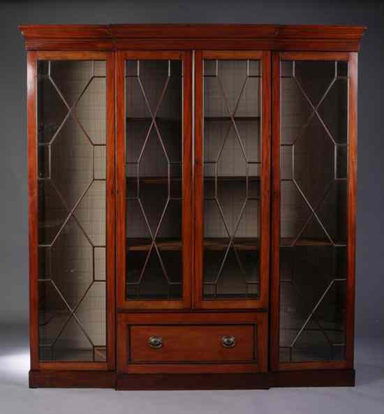 Appraisal: ENGLISH REGENCY MAHOGANY BREAKFRONT CHINA CABINET th century Molded crest