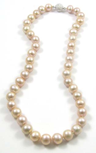 Appraisal: PRINCESS LENGTH PINK PEARL NECKLACE strung with well matched pink