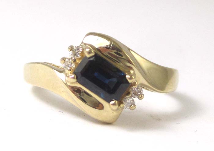 Appraisal: SAPPHIRE DIAMOND AND FOURTEEN KARAT GOLD RING set with four