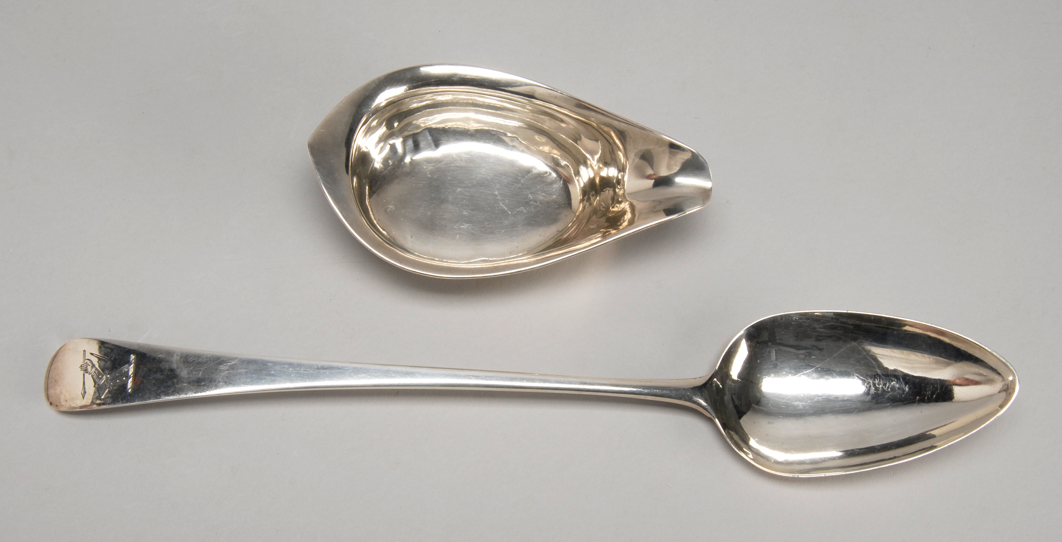 Appraisal: GEORGIAN SILVER STUFFING SPOON Together with an early English silver