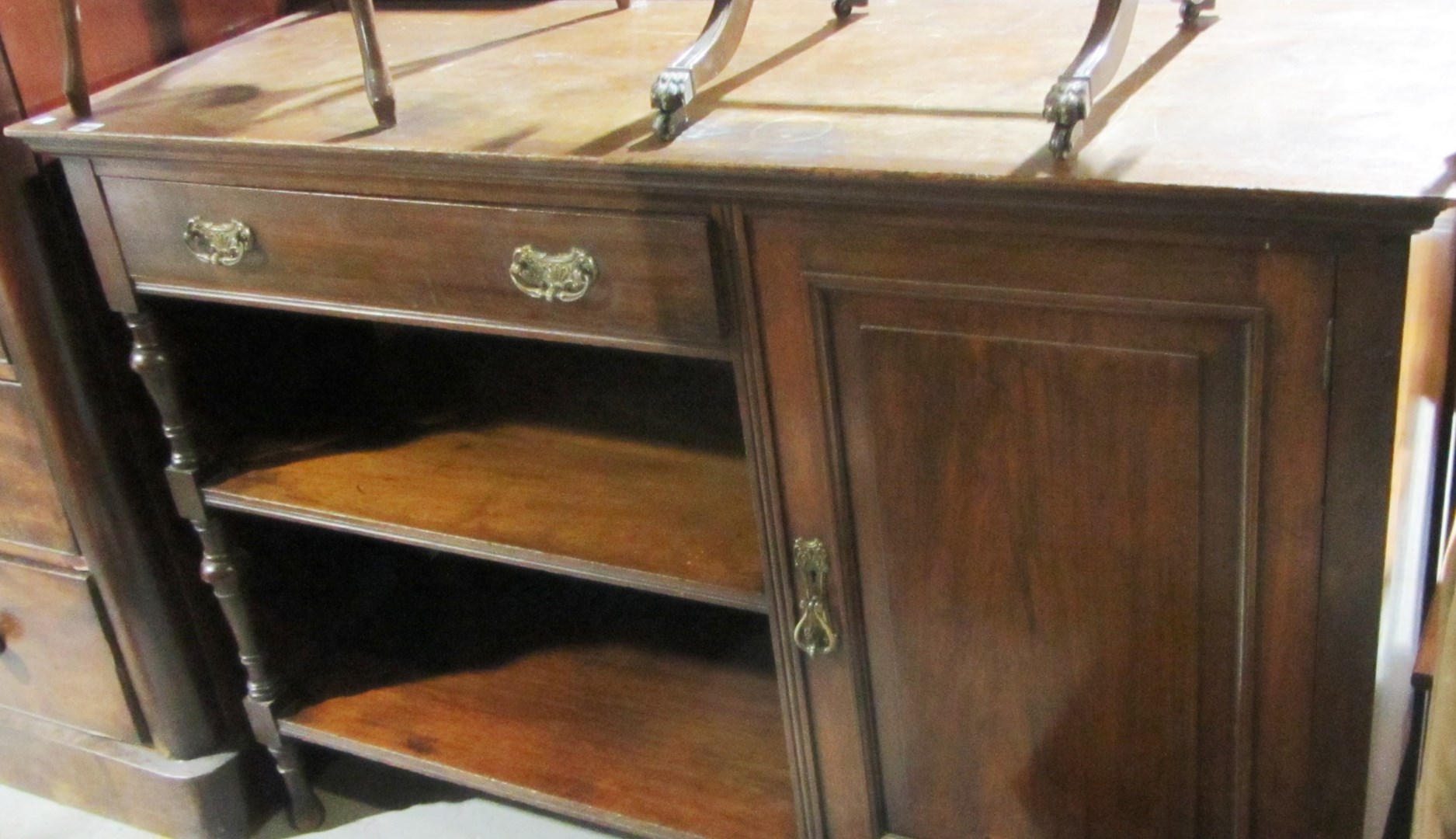 Appraisal: A mahogany side cabinet with a single drawer a pair