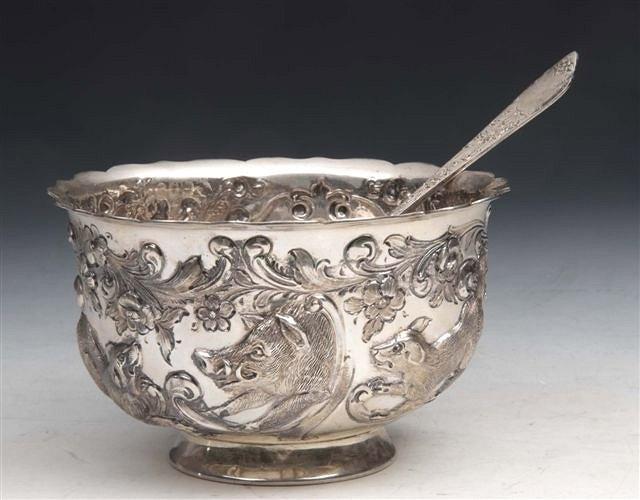 Appraisal: AN EDWARDIAN SILVER BOWL chased with a boar hunting scene