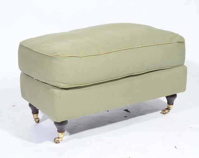 Appraisal: A GREEN UPHOLSTERED FOOT STOOL standing on turned legs and