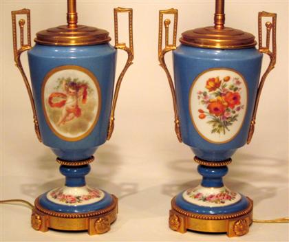 Appraisal: Pair Sevres style gilt bronze mounted blue ground porclain urnsEach