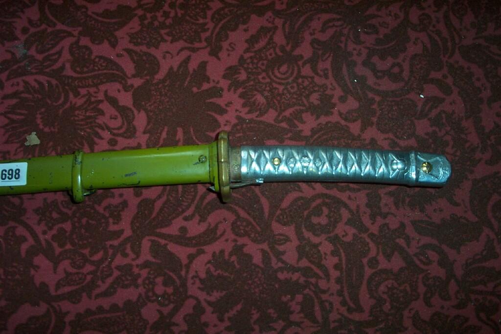 Appraisal: A Japanese NCO's sword with green painted scabbard -