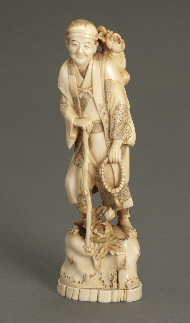 Appraisal: Japanese Partial Darkened Engraved Ivory Figure of Traveler Signed Tamayuki