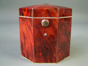 Appraisal: A George III red tortoiseshell tea caddy of octagonal form