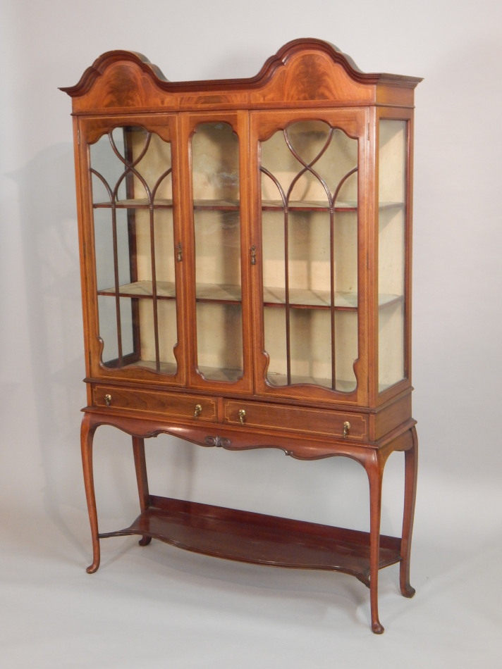 Appraisal: An Edwardian mahogany and checker banded display cabinet the double