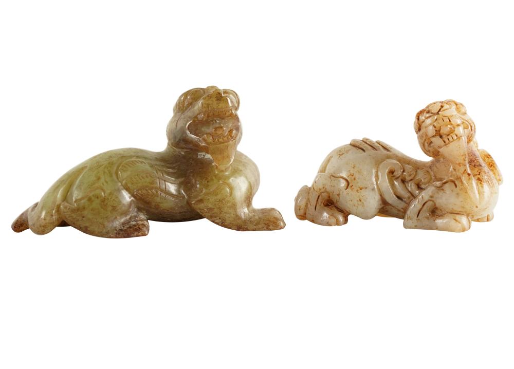 Appraisal: TWO CARVED JADE FOO DOG FIGURESCondition no chips or breaks