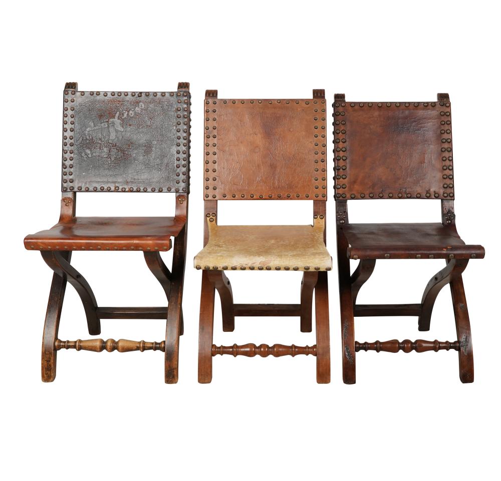 Appraisal: THREE WILLIAM SPRATLING-STYLE FOLDING CHAIRSleather and wood unsigned Condition one