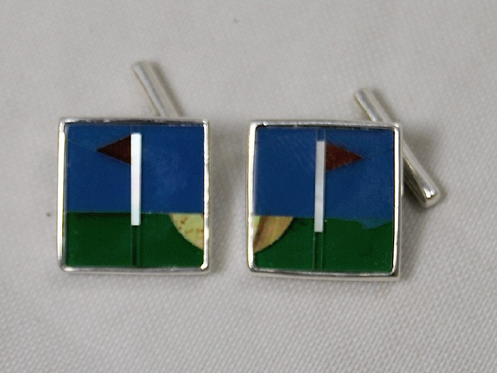 Appraisal: Pair of white metal set cufflinks with golf design