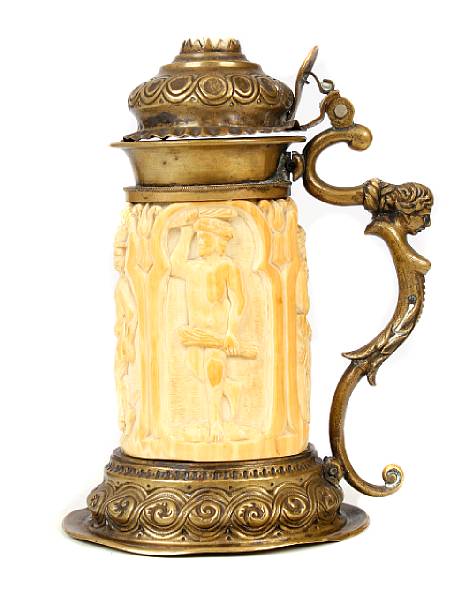 Appraisal: A Continental gilt metal mounted carved ivory small tankard circa