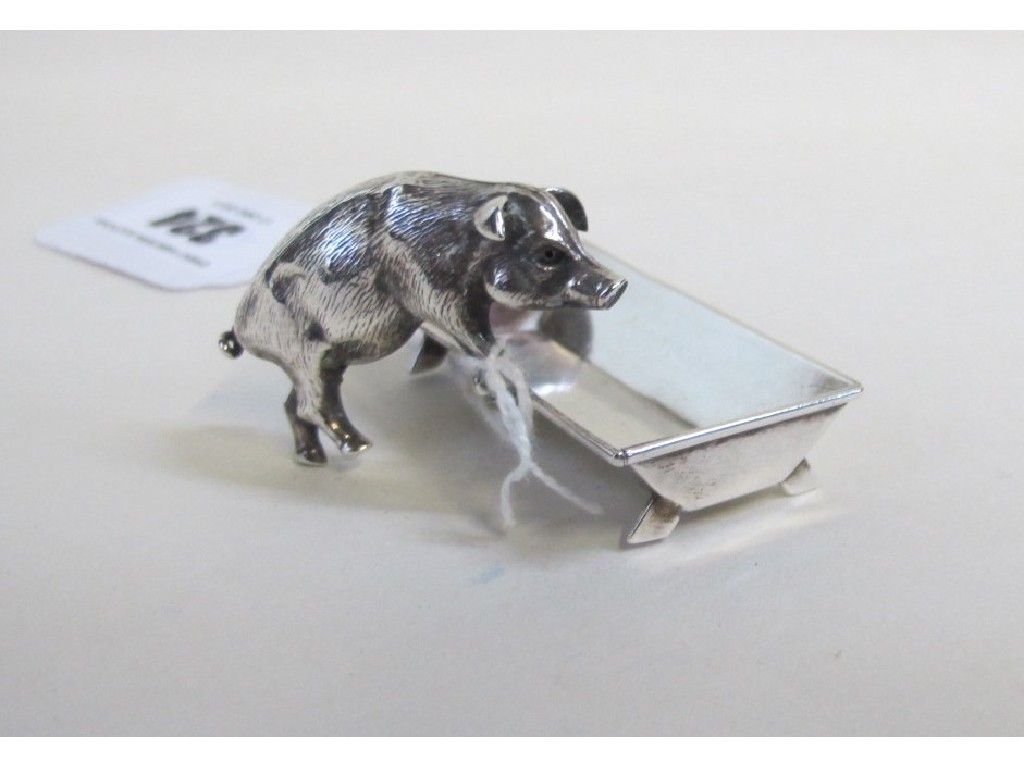 Appraisal: Novelty silver salt modelled as a pig at a trough