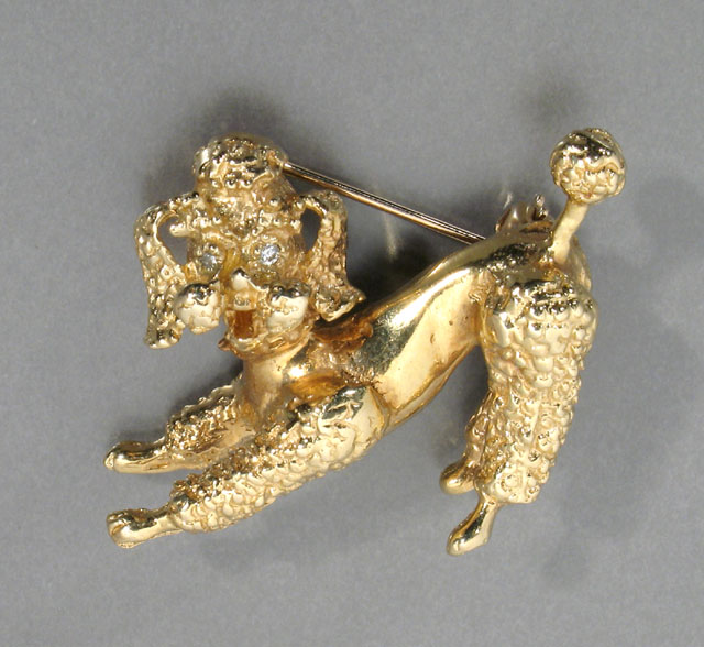 Appraisal: FOURTEEN KARAT YELLOW GOLD PLAYFUL POODLE BROOCH with inset diamond