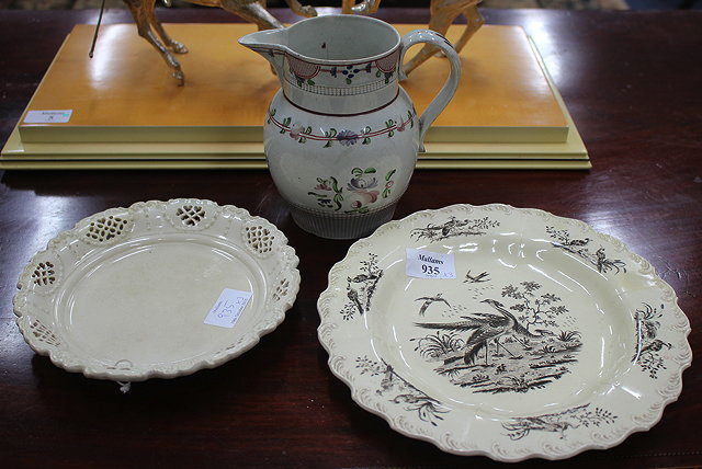 Appraisal: A CREAMWARE PLATE DECORATED WITH EXOTIC BIRDS together with a