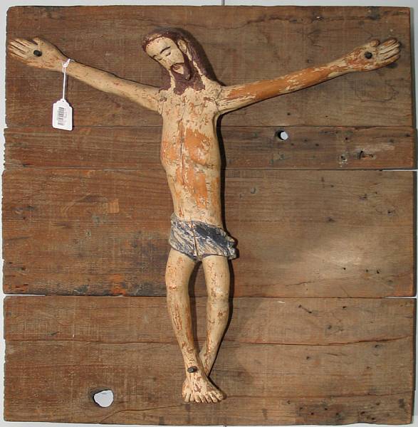 Appraisal: A Spanish Colonial polychrome sabino wood crucifix on panel th