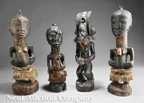 Appraisal: A Pair of African Carved Wood Figures the male and