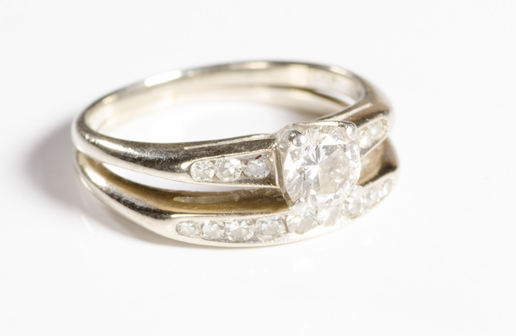 Appraisal: DIAMOND AND FOURTEEN KARAT WHITE GOLD RING featuring a round