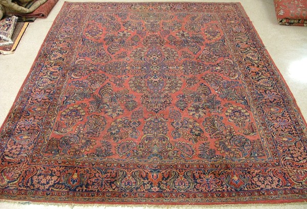 Appraisal: SEMI-ANTIQUE PERSIAN SAROUK CARPET overall floral design on red ground