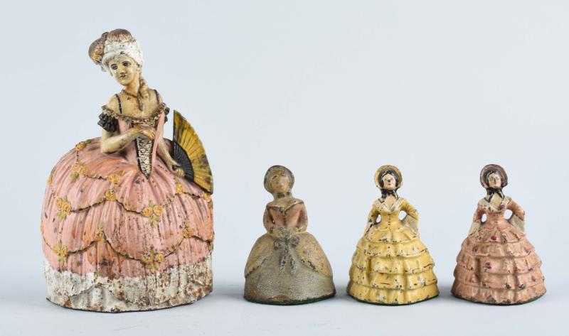 Appraisal: Cast Iron Asst Women In Hooped Skirts Doorstops Large lady