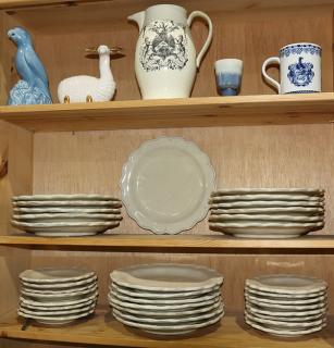 Appraisal: Six shelves of decorative table articles including Mexican stoneware plates