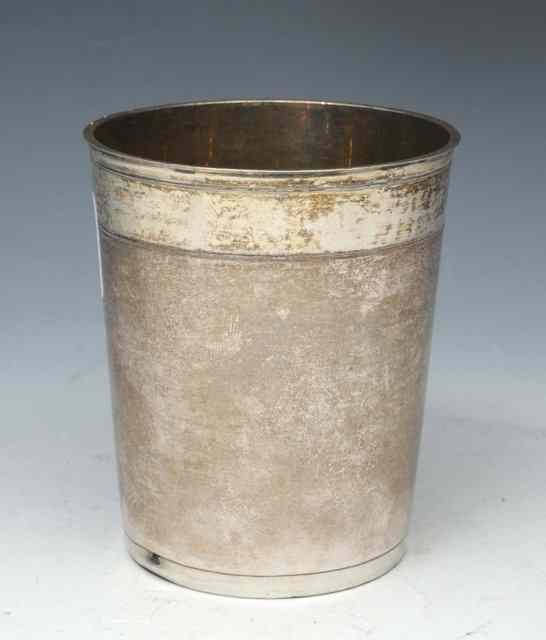 Appraisal: A TH CENTURY GERMAN WHITE METAL BEAKER of tapering cylindrical