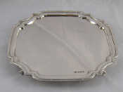 Appraisal: A silver waiter of shaped rectangular form with incurved corners