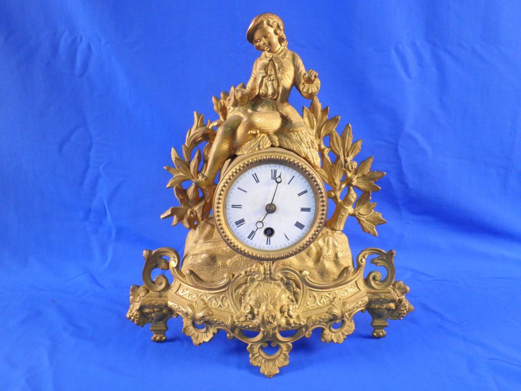 Appraisal: A late thC gilt spelter mantel clock with a white