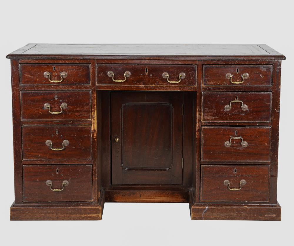 Appraisal: GEORGIAN OAK DOUBLE-PEDESTAL DESKwith gilt-tooled leather-inset writing surface Condition hardware