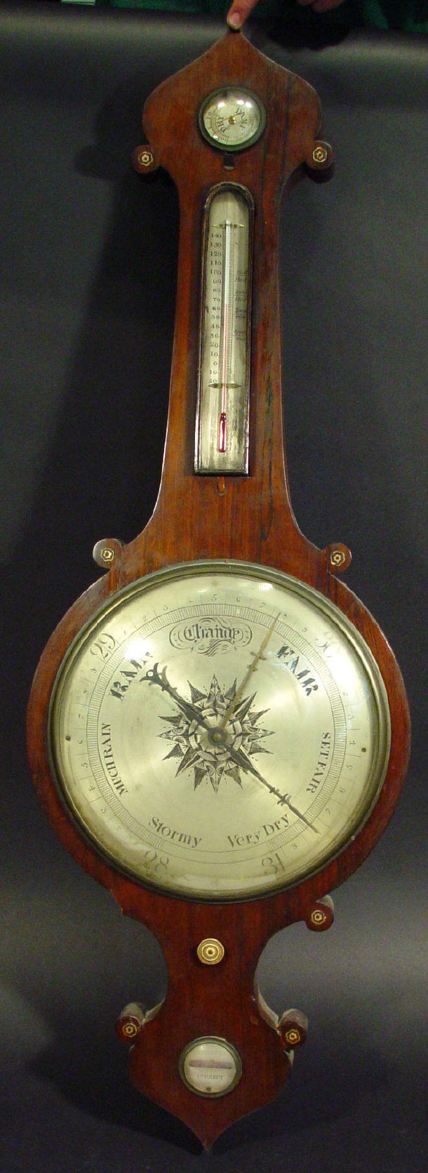 Appraisal: th century rosewood wheel barometer with silvered main dial mercury