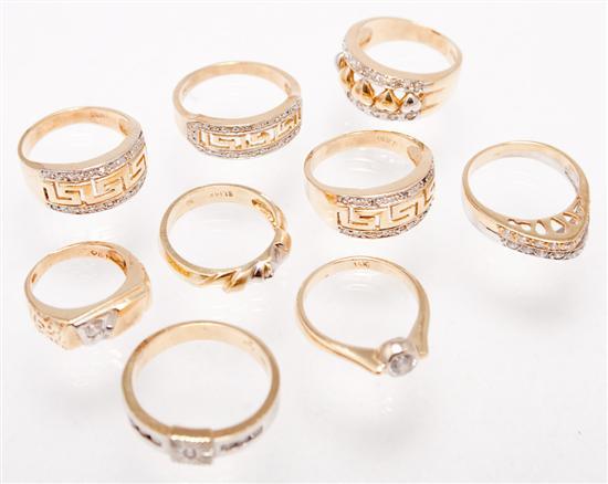 Appraisal: Nine K yellow gold and faux diamond rings grams