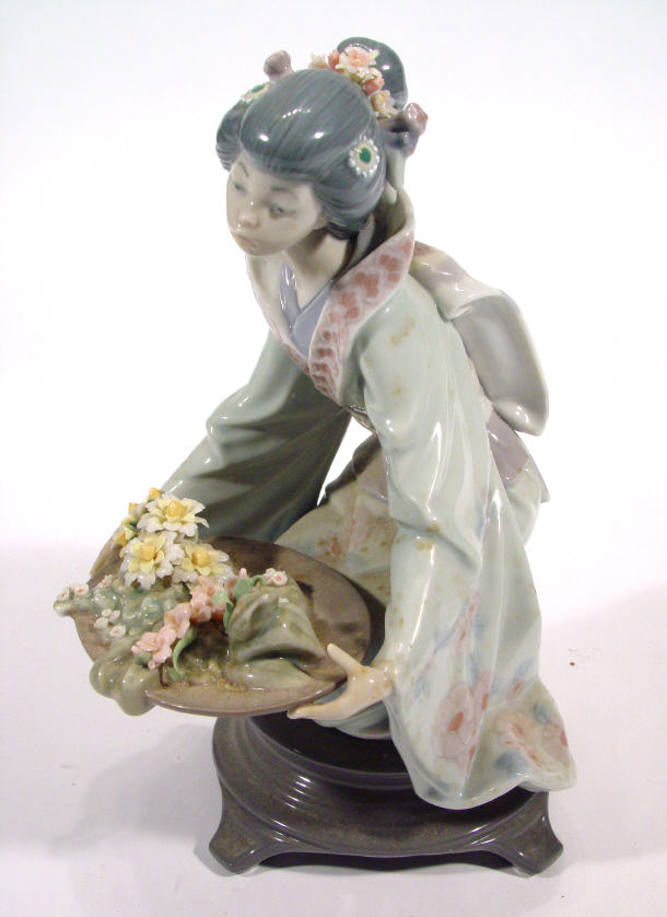 Appraisal: Lladro porcelain geisha girl clutching a tray of flowers factory