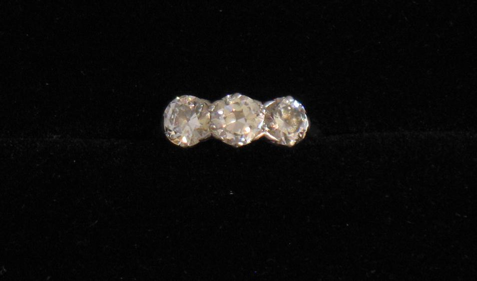 Appraisal: A THREE STONE DIAMOND RING the three round brilliant-cut diamonds