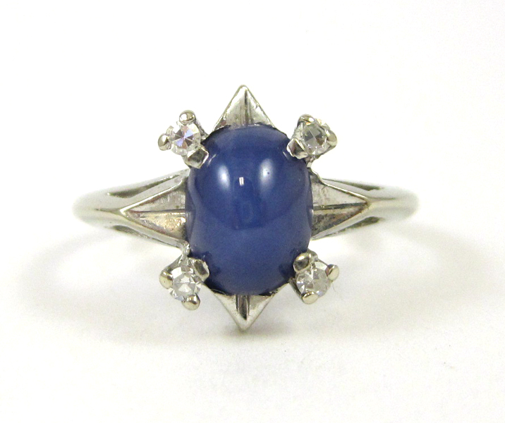 Appraisal: SYNTHETIC STAR SAPPHIRE AND DIAMOND RING The k white gold