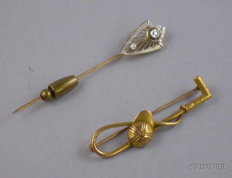 Appraisal: Two Stickpins a kt gold jockey cap and whip and