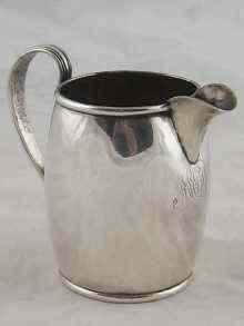 Appraisal: A Russian silver barrel shaped cream jug by Franz Kernig