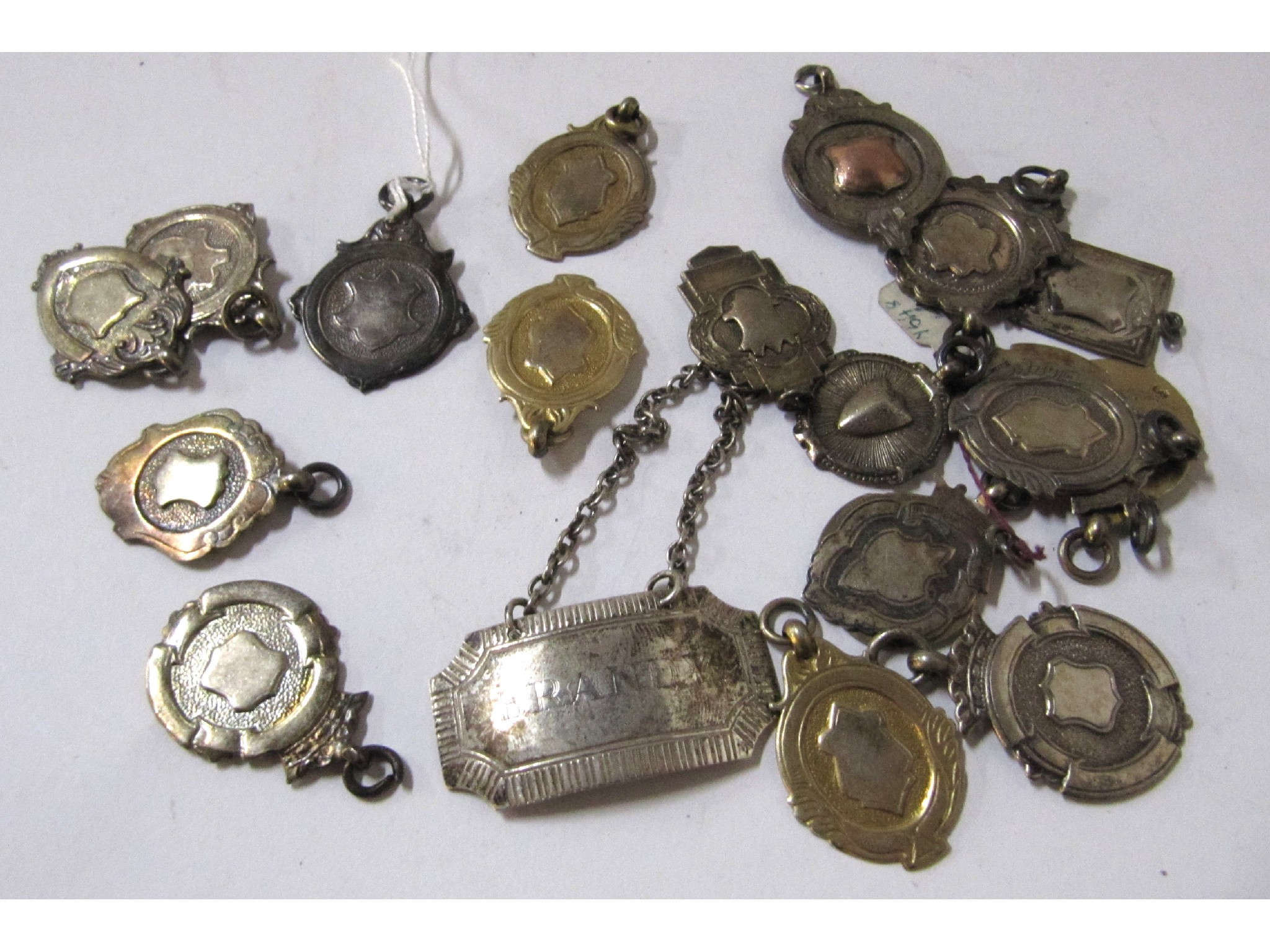 Appraisal: A lot comprising assorted silver and EPNS medal fobs and