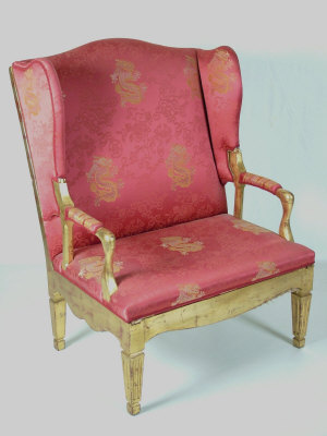 Appraisal: A giltwood upholstered adjustable wing armchair with padded arms above