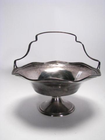 Appraisal: Sterling silver handled basket hammered and hand chased fixed handle