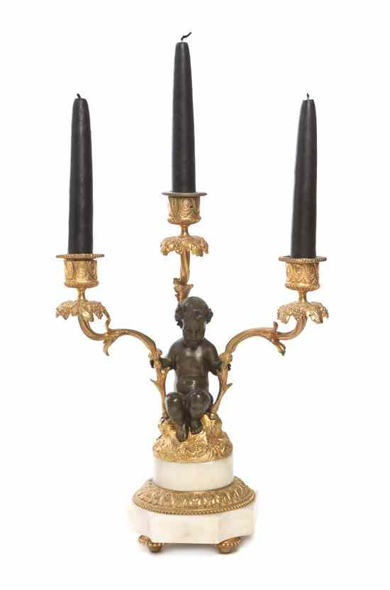 Appraisal: A Neoclassical Style Gilt and Patinated Bronze Three-Light Candelabrum having